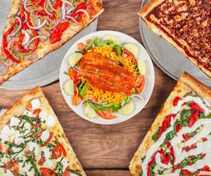 salad with BBQ chicken, assorted pizza slices